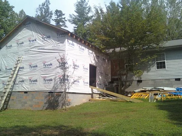 Tyvek wrapped gable on a new room addition beside an existing home in Havertown
